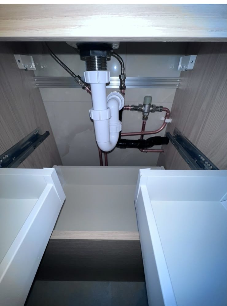 Kitchen sink waste and mixer supplies installed inside a base unit