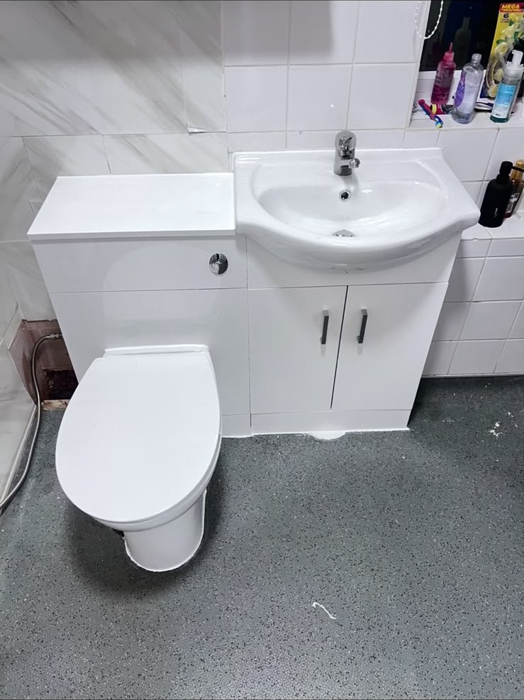 Finished cloakroom with combined vanity and concealed cistern WC